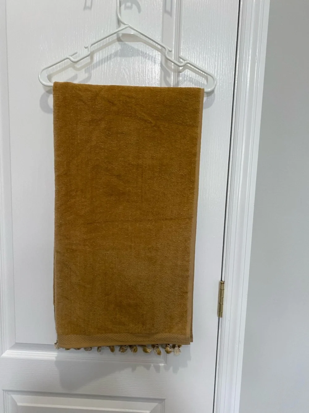 Avanti Mustard Decorative Hand Towel with Tassel Border